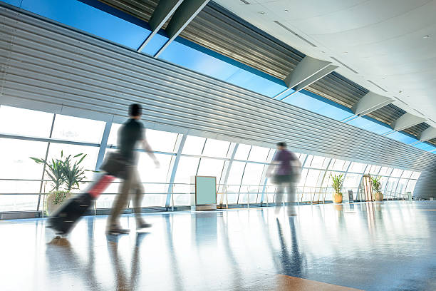 istock passenger walking in airport corridor 465066884