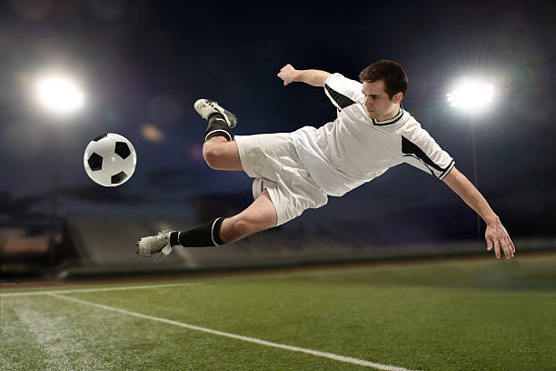 istock Soccer player jumping and kicking 465067295