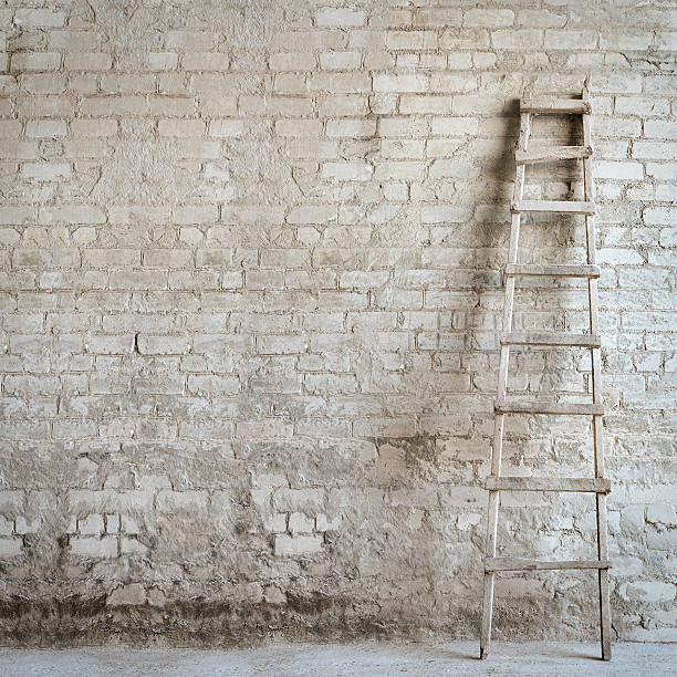 brick wall background brick wall background , ladder near the wall flour mill stock pictures, royalty-free photos & images