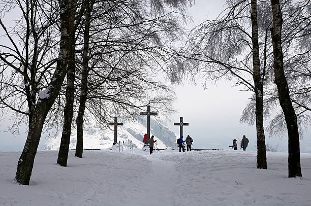 Sesto, Italy - January 14, 2010: cemetery in the snow with beautiful crosses in wrought iron. Photo taken in the village of Sesto, an alpine resort surrounded by the Carnic Alps and the Dolomites of Sesto.