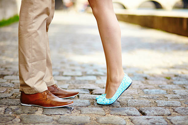 istock Male and female legs during a date 465068726