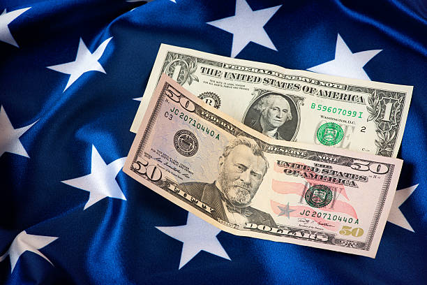 istock US Currency with American Flag 465070492