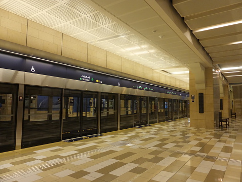 Dubai, UAE - February 2, 2014: Dubai Metro Al Ras Station in Dubai, UAE. Dubai Metro is a driverless network. Guinness World Records declared it the worlds longest fully automated metro network.
