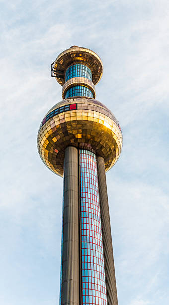 District heating Vienna of Hundertwasser forms Vienna, Austria - July 22, 2009: The chimney of the most famous District heating in Vienna of artist Hundertwasser in intensive afternoon light in Vienna, Austria. hundertwasser haus in vienna austria stock pictures, royalty-free photos & images