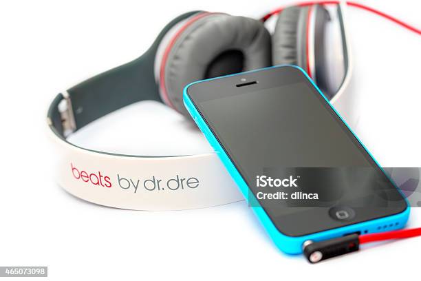 Apple Iphone 5c With Beats Headphones By Dr Dre Stock Photo - Download Image Now - Defeat, Headphones, 2015