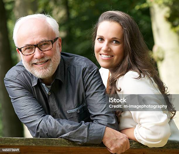 Mature Father And Young Daughter Smiling Outdoors Stock Photo - Download Image Now - Adult, Daughter, Father