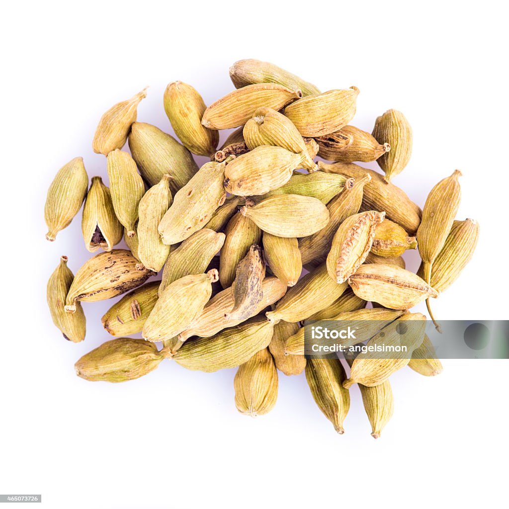 Cardamom seeds isolated on a white background Green cardamom seeds isolated on a white background 2015 Stock Photo