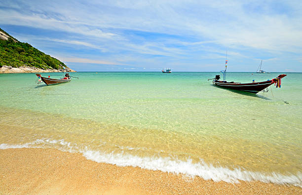 istock Longtail boat floating on transparent water 465074443