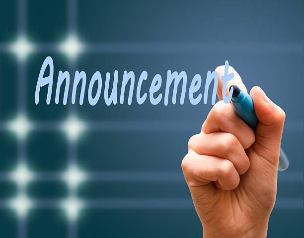 istock Hand writing with maker an announcement blue background 465075302