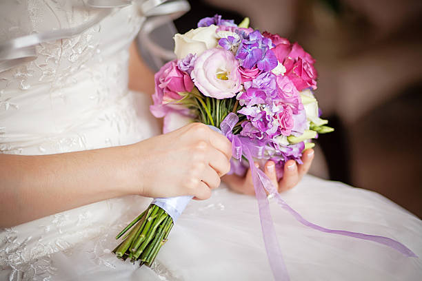 istock wedding bouquet in the hands of  bride 465075836