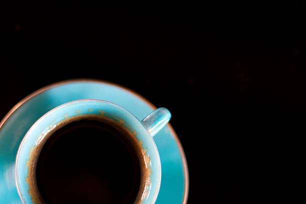 istock Black Coffee in Elegant Turquoise Cup with Black Background 465075856