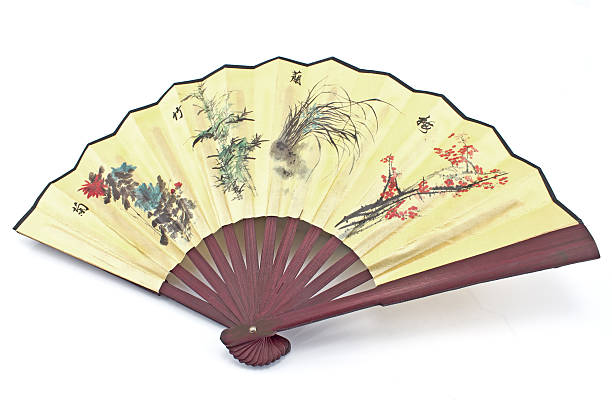 istock Wooden yellow oriental fan on white background 465076813