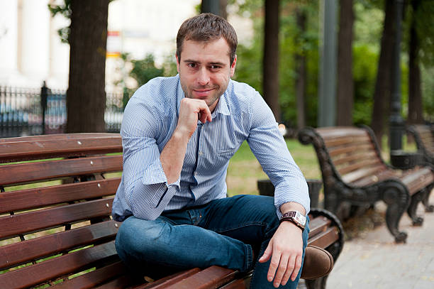 istock Man relaxing in the public garden 465078029