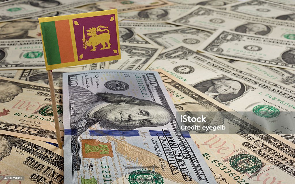 Flag of Sri Lanka sticking in various american banknotes.(series Flag of Sri Lanka sticking in a variety of american banknotes.(series) 2015 Stock Photo