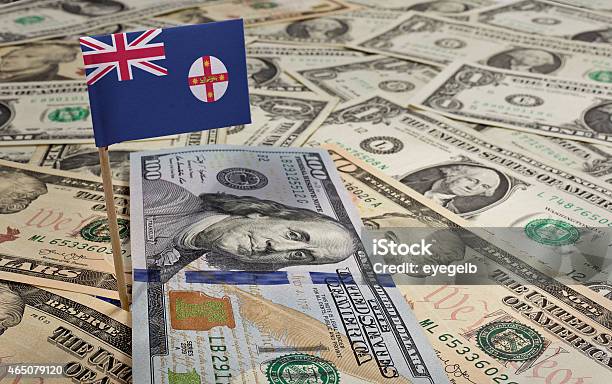 Flag Of New South Wales Sticking In Various American Banknotes Stock Photo - Download Image Now