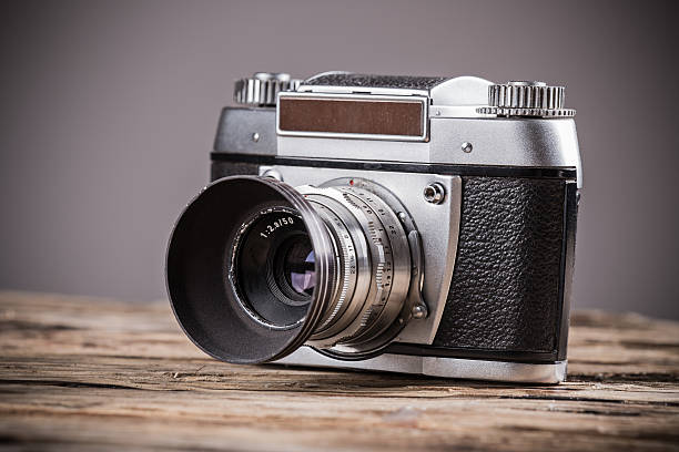 istock Vintage camera on a wooden background 465079966