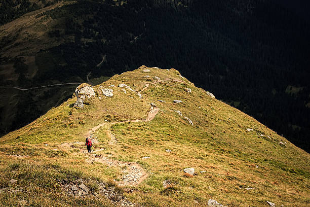 istock Climber descends the steep slope of mountain 465080008