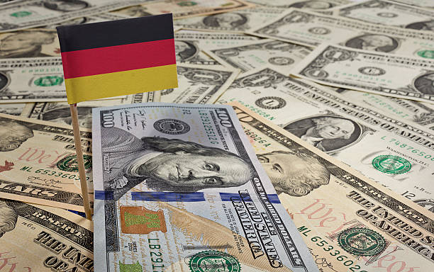 istock Flag of Germany sticking in various american banknotes.(series) 465081798