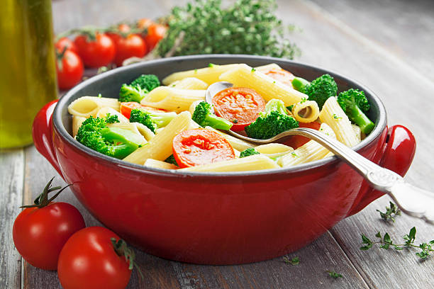istock Penne pasta with broccoli and cherry tomatoes 465081961
