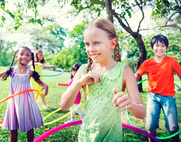 istock Group of Children Playing Hula Hoop Concept 465088594