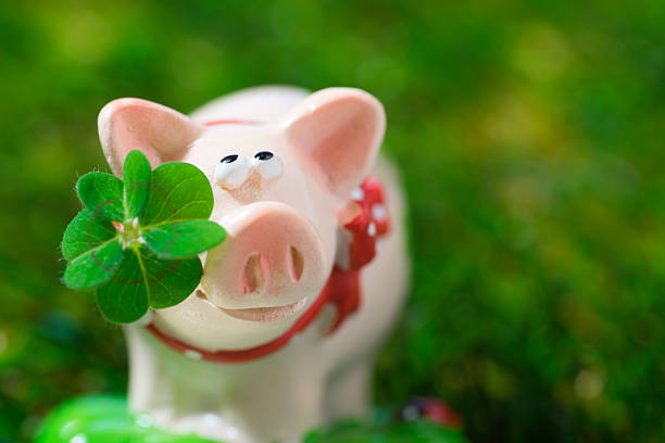 istock Lucky charm pig, figurine with cloverleaf 465088796