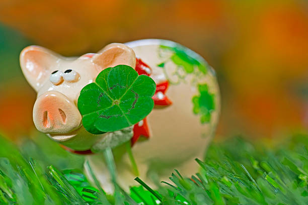 istock Lucky charm pig, figurine with cloverleaf 465088812