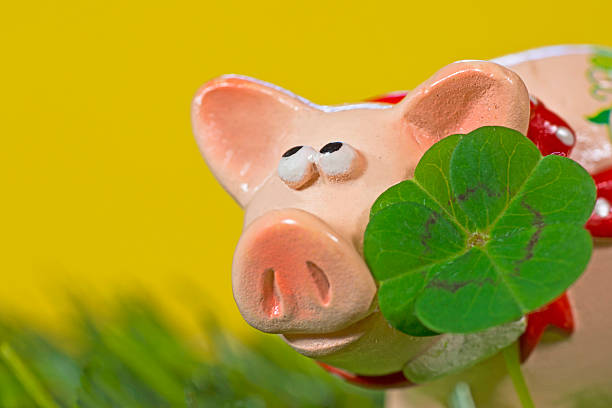 istock Lucky charm pig, figurine with cloverleaf 465088820