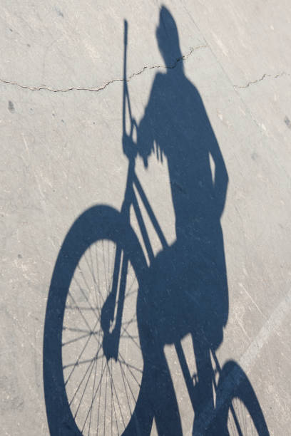 istock shadow of boy with bike 465089443