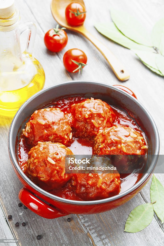 Meatballs with rice Meatballs with rice and tomato sauce in the pot Animal Stock Photo