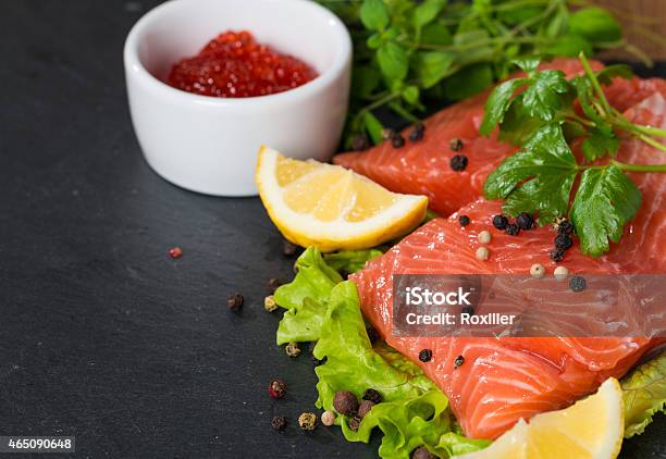 Fresh Salmon And Red Caviar On Black Plate Stock Photo - Download Image Now - Rear View, Salmon - Seafood, 2015