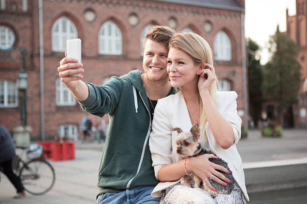 istock Young couple walking with their dog. 465095470
