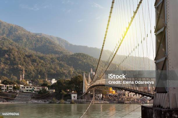 View Of River Ganga And Ram Jhula Bridge Stock Photo - Download Image Now - 2015, Architecture, Asia