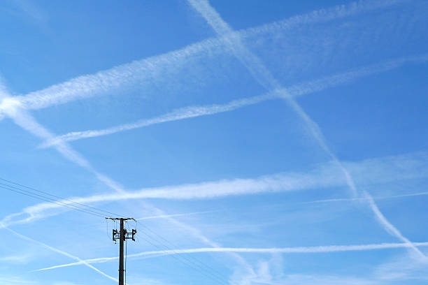 Pattern of airplane trails of condensed air crisscrossing each