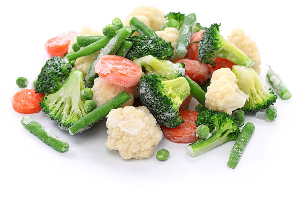 Frozen broccoli, carrots, peas, cauliflower, and green beans stock photo