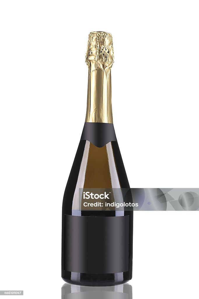 Brown bottle of champagne with golden top. Brown bottle of champagne with golden top. Isolated on a white background. Alcohol - Drink Stock Photo