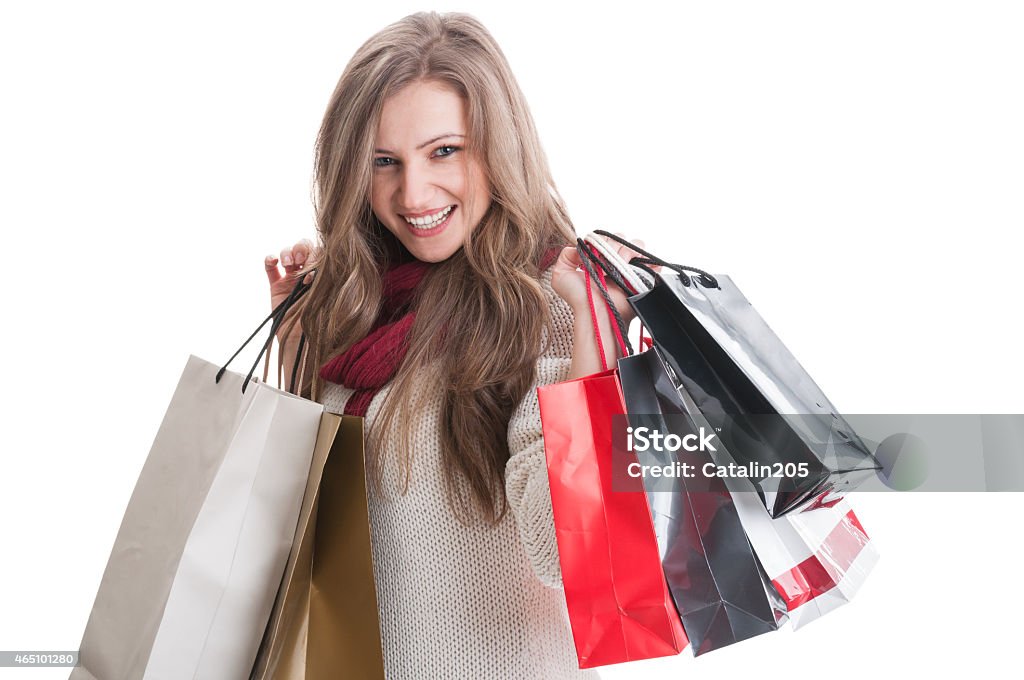 Beautiful and happy shopping girl Beautiful and happy shopping girl posing on white background 2015 Stock Photo