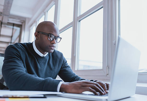 istock African american businessman working on his laptop 465102236