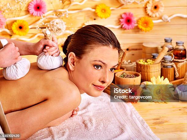 Woman Getting Herbal Ball Massage Stock Photo - Download Image Now - 2015, Adult, Alternative Therapy