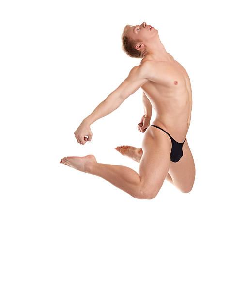 istock Muscular half-naked man jumping, isolated on white 465102728