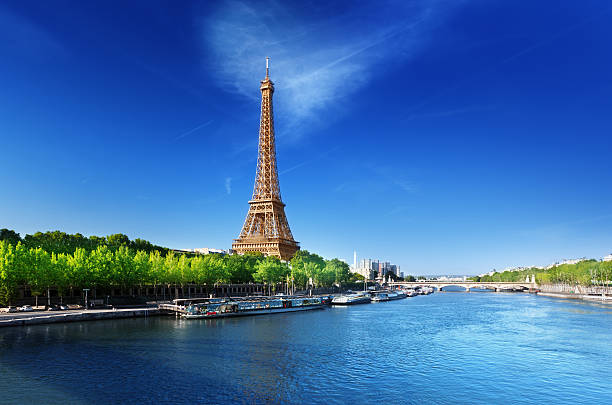 Seine in Paris with Eiffel tower in sunrise time Seine in Paris with Eiffel tower in sunrise time seine river stock pictures, royalty-free photos & images