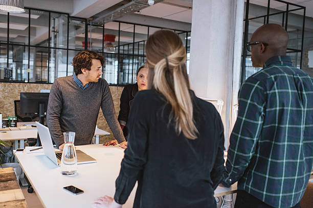 istock Team of young designers working together in office 465104660