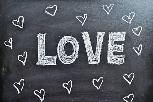 istock The word Love and hearts on a blackboard, background 465104936
