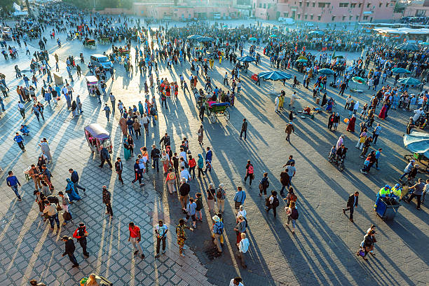 Famous Djemaa El Fna Square in early evening light, Marrakech, Morocco with the Koutoubia Mosque, Northern Africa.