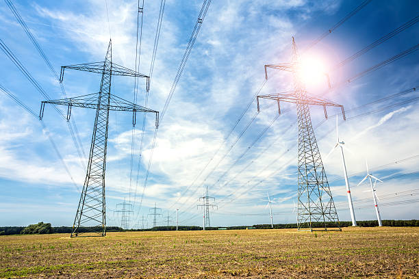 istock Wind energy and High Voltage Towers 465105602