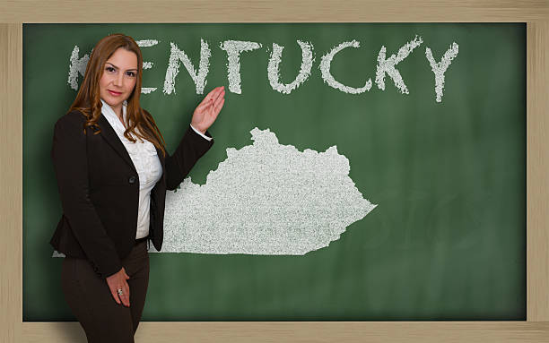 istock Teacher showing map of kentucky on blackboard 465109358