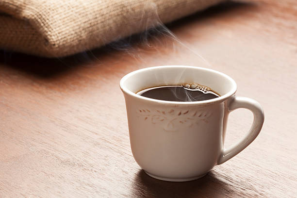 istock white cup of coffee with beautiful smoke 465110912