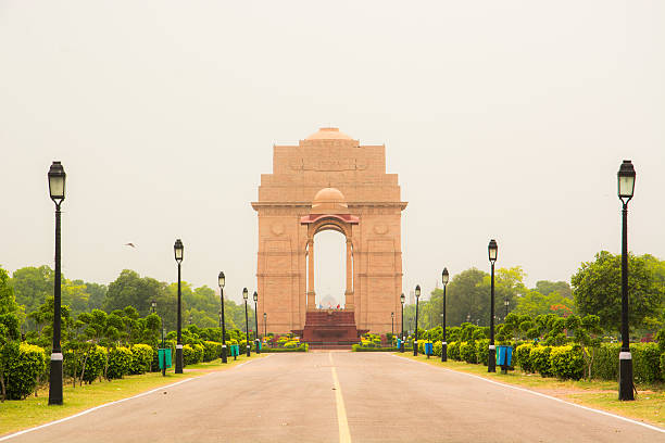 India gate The foundation stone of India Gate was laid by His Royal Highness, the Duke of Connaught in 1921 and it was designed by Edwin Lutyens. The monument was dedicated to the nation 10 years later by the then Viceroy, Lord Irwin. Another memorial, Amar Jawan Jyoti was added much later, after India got its independence. The eternal flame burns day and night under the arch to remind the nation of soldiers who laid down their lives in the Indo-Pakistan War of December 1971.  delhi photos stock pictures, royalty-free photos & images