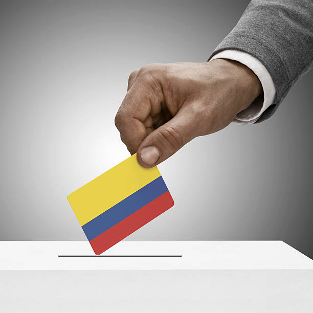 istock Black male holding flag. Voting concept - Colombia 465112256