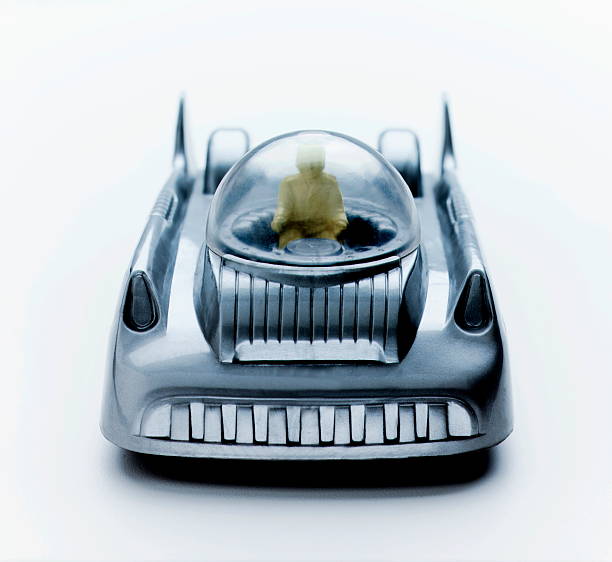 istock Person Driving Silver Futuristic Car 465112928