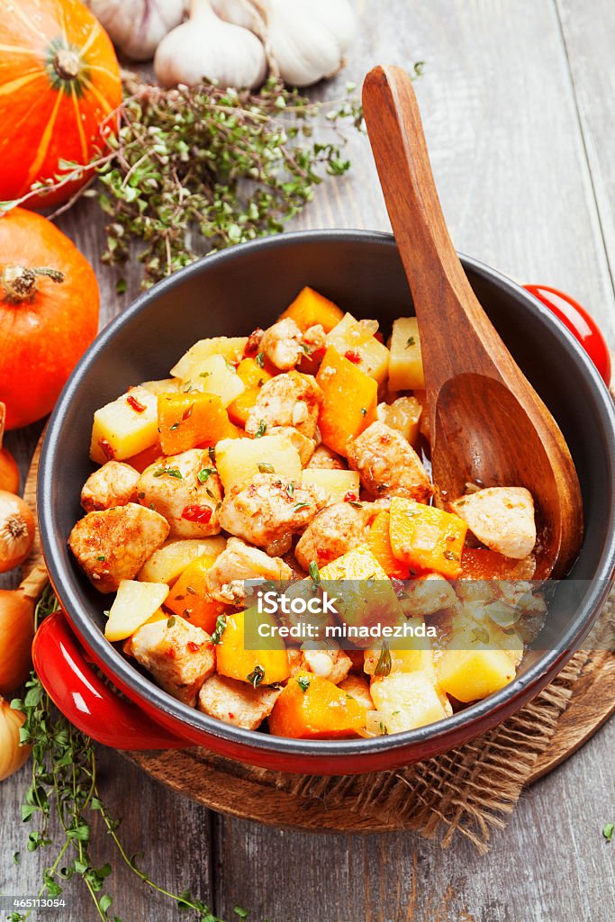 Chicken stew with pumpkin, potatoes and spices Chicken stew with pumpkin, potatoes and spices on the table 2015 Stock Photo